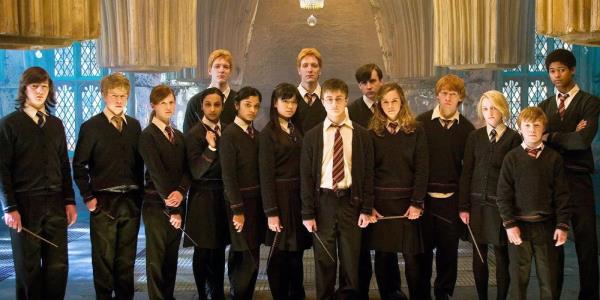 Harry, Ron, and Hermione pose with members of Dumbledore's Army in Harry Potter 5.